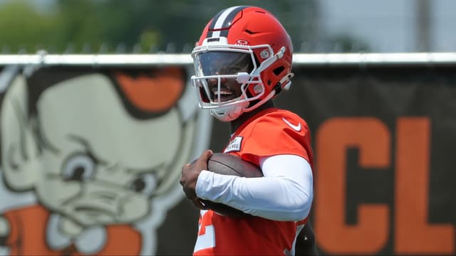 Browns quarterback Shedeur Sanders celebrates after breaking away for a big gain during practice, Wednesday, June 11, 2025, in Berea.
