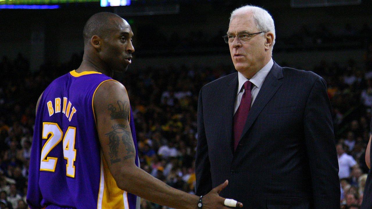 Los Angeles Lakers shooting guard Kobe Bryant (24) talks to head coach Phil Jackson (right) during the second quarter against the Golden State Warriors at ORACLE Arena.