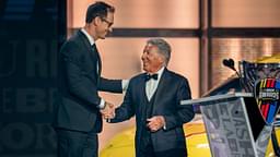 NASCAR Cup Series champion Joey Logano, left, is greeted by Mario Andretti, right, during the NASCAR Awards Show at Music City Center in Nashville, Tenn., Thursday, Dec. 1, 2022.