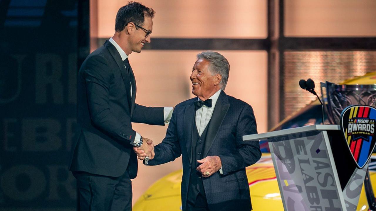 NASCAR Cup Series champion Joey Logano, left, is greeted by Mario Andretti, right, during the NASCAR Awards Show at Music City Center in Nashville, Tenn., Thursday, Dec. 1, 2022.