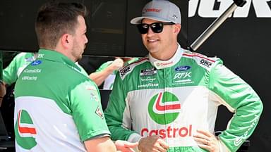 NASCAR Cup Series driver Ryan Preece (60) talks by his pit box Saturday, July 26, 2025, during qualifying for the Pennzoil 250 at Indianapolis Motor Speedway.