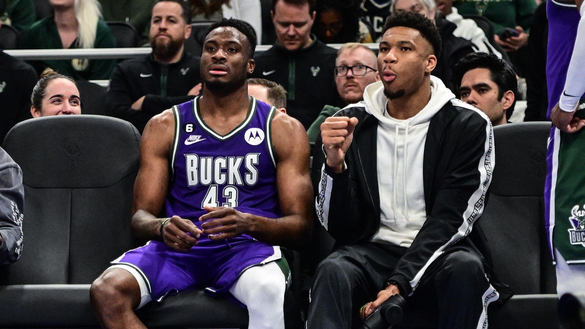 Apr 7, 2023; Milwaukee, Wisconsin, USA; Milwaukee Bucks forward Giannis Antetokounmpo (34) sits with his brother forward Thanasis Antetokounmpo (43) in the fourth quarter during game against the Memphis Grizzlies at Fiserv Forum.