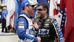 NASCAR Sprint Cup Series drivers Jimmie Johnson (L) and driver Tony Stewart (14) (R) share a laugh prior to the GoBowling.com 400 at Pocono Raceway.