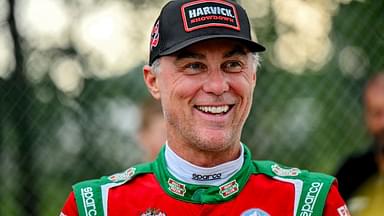 Former NASCAR Cup Series champion Kevin Harvick smiles during an autograph session before the 13th annual Masters of the Pros 200 race on Wednesday, July 16, 2025, at the Owosso Speedway. Harvick and his 13-year-old son Keelan competed against each other in the race later in the night.