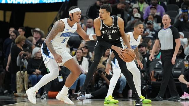 San Antonio Spurs center Victor Wembanyama (1) looks to pass in front of Orlando Magic forward Paolo Banchero (5) in the second half at Frost Bank Center.