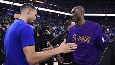 Golden State Warriors guard Stephen Curry (30, left) shakes hands with Los Angeles Lakers forward Kobe Bryant (24, right) before the game at Oracle Arena.
