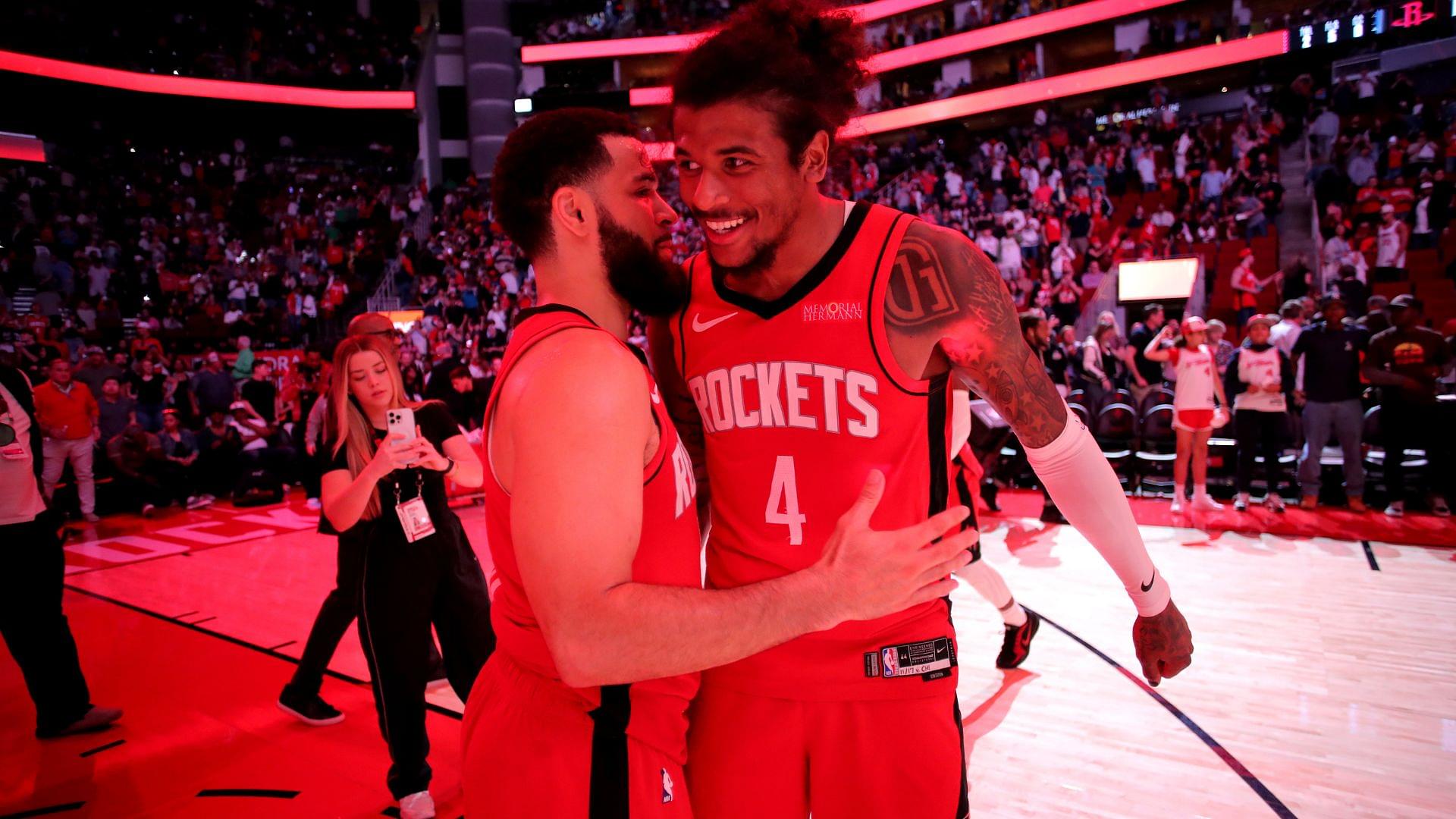Mar 15, 2025; Houston, Texas, USA; Houston Rockets guard Fred VanVleet (5) congratulates guard Jalen Green (4) following the game against the Chicago Bulls at Toyota Center.