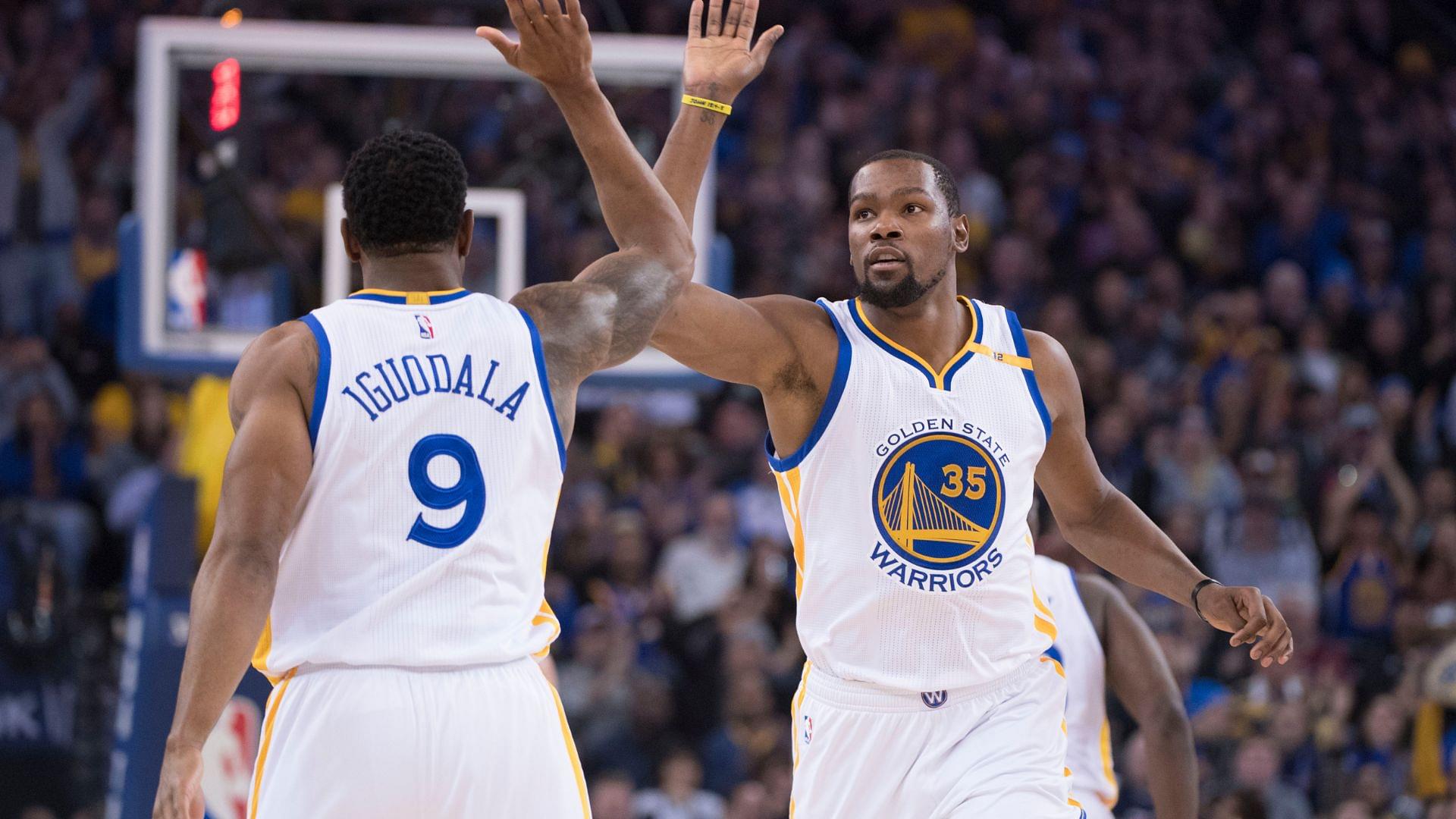 January 4, 2017; Oakland, CA, USA; Golden State Warriors forward Kevin Durant (35) celebrates with forward Andre Iguodala (9) against the Portland Trail Blazers during the first quarter at Oracle Arena.