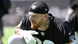 Las Vegas Raiders defensive end Maxx Crosby (98) looks on during the team stretch during Las Vegas Raiders Minicamp at Intermountain Health Performance Center.