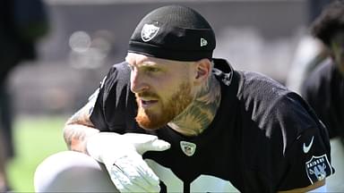 Las Vegas Raiders defensive end Maxx Crosby (98) looks on during the team stretch during Las Vegas Raiders Minicamp at Intermountain Health Performance Center.
