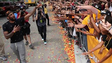 Cleveland Cavaliers Kyrie Irving celebrates with the crowd in downtown Cleveland Cleveland Cavaliers Kyrie Irving celebrates with the crowd during a parade to celebrate winning the 2016 NBA Championship in downtown Cleveland, Ohio.