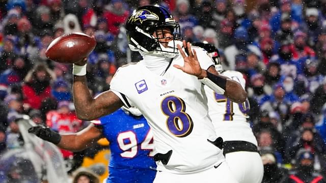 Jan 19, 2025; Orchard Park, New York, USA; Baltimore Ravens quarterback Lamar Jackson (8) drops back to pass during the first quarter against the Buffalo Bills in a 2025 AFC divisional round game at Highmark Stadium.