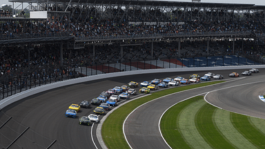 INDIANAPOLIS, IN - JULY 21: The field races into turn one on the stage two restart during the NASCAR, Motorsport, USA Cup Series Brickyard 400 on July 21, 2024, at the Indianapolis Motor Speedway in Indianapolis, Indiana. (Photo by Michael Allio Icon Sportswire) AUTO: JUL 21 NASCAR Cup Series Brickyard 400 EDITORIAL USE ONLY Icon116240721018