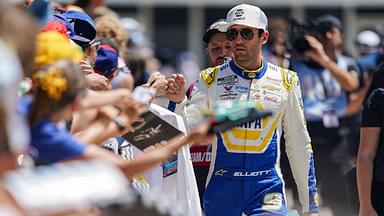NASCAR Cup Series driver Chase Elliott (9) signs autographs for fans on Sunday, July 27, 2025, ahead of the Brickyard 400 at Indianapolis Motor Speedway.
