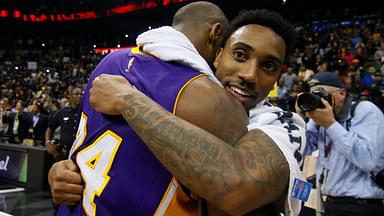 Los Angeles Lakers forward Kobe Bryant (24) hugs Atlanta Hawks guard Jeff Teague (0) after a game at Philips Arena. The Hawks defeated the Lakers 100-87.