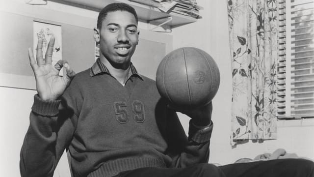 Wilt Chamberlain Smiling with Basketball Vintage 1960 s capture of Wilt Chamberlain smiling while spinning a basketball.