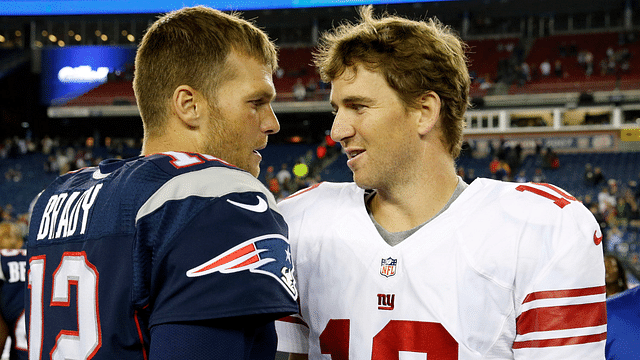 New England Patriots quarterback Tom Brady (12) and New York Giants quarterback Eli Manning (10) meet on the field after the game Gillette Stadium