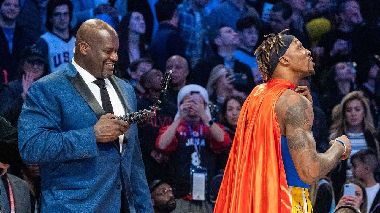 NBA great Shaquille O'Neal (left) videotapes Los Angeles Lakers player Dwight Howard (right) in a Superman costume dedicated to the late Los Angeles Lakers great Kobe Bryant during NBA All Star Saturday Night at United Center.