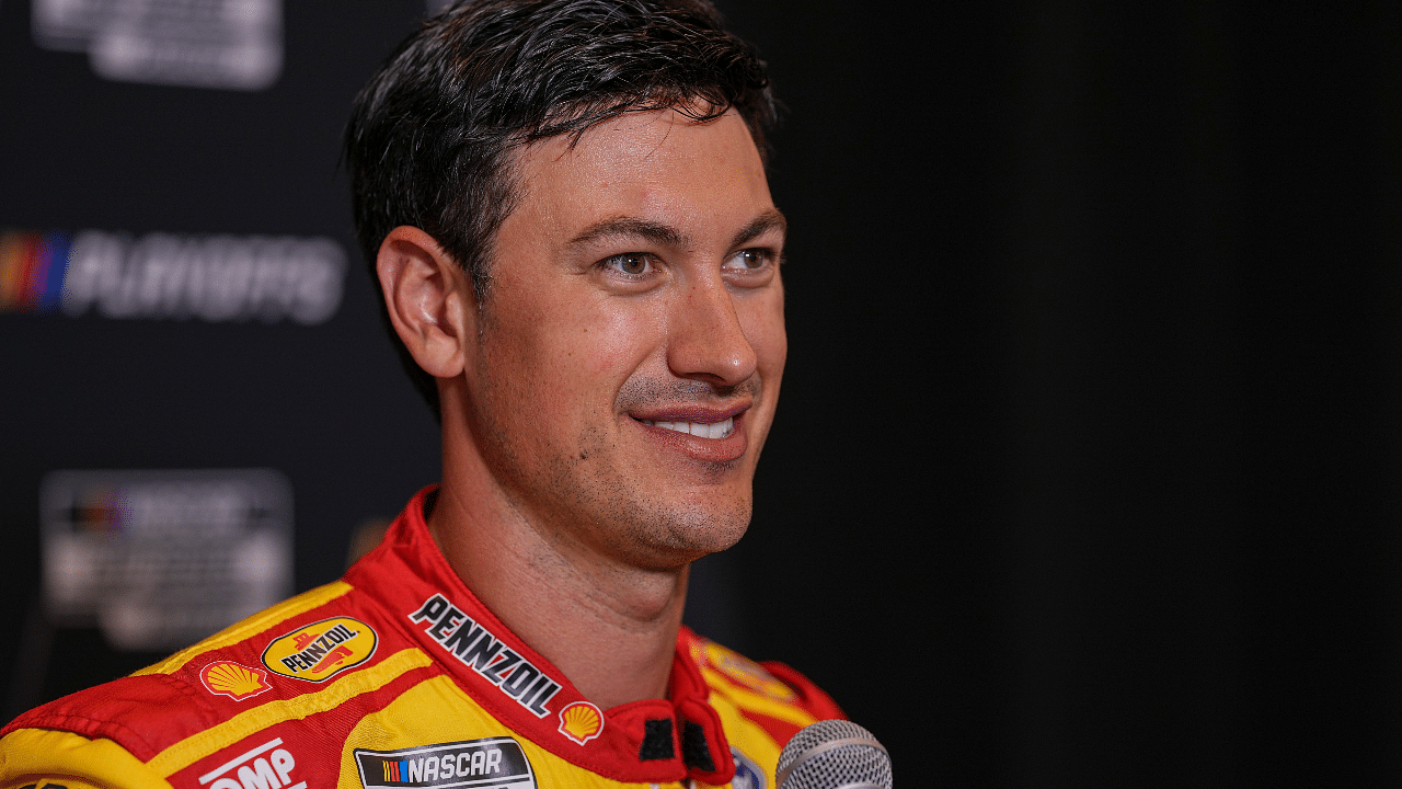 Joey Logano speaks to media members during the NASCAR Playoffs Media Day at the Charlotte Convention Center. Mandatory Credit: Jim Dedmon-Imagn Images
