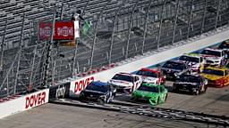 NASCAR Cup Series driver Martin Truex Jr. (19) and NASCAR Cup Series driver Kyle Busch (18) lead a restart during the NASCAR Cup Series at Dover International Speedway.
