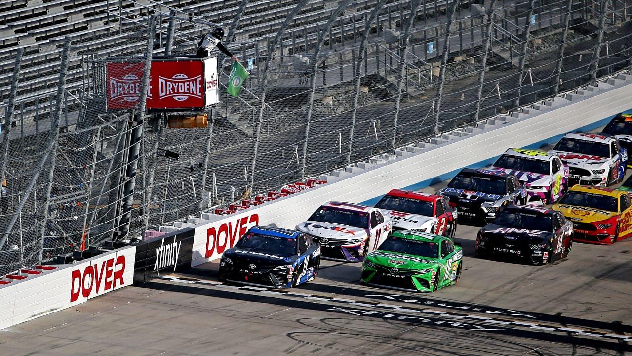 NASCAR Cup Series driver Martin Truex Jr. (19) and NASCAR Cup Series driver Kyle Busch (18) lead a restart during the NASCAR Cup Series at Dover International Speedway.