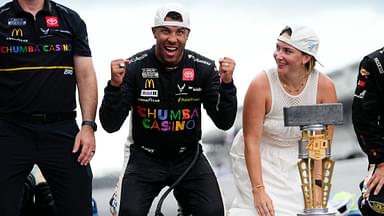 NASCAR Cup Series driver Bubba Wallace (23) celebrates on the yard of bricks Sunday, July 27, 2025, during the Brickyard 400 at Indianapolis Motor Speedway.