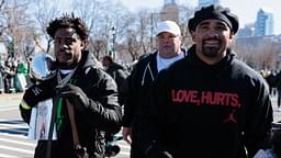 Philadelphia Eagles safety C.J. Gardner-Johnson (8) carries the Lombardi Trophy alongside quarterback Jalen Hurts (1) during the Super Bowl LIX championship parade and rally.
