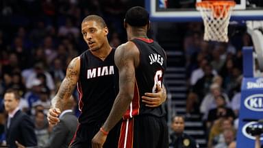 Miami Heat small forward Michael Beasley (8) talks with small forward LeBron James (6) during the second quarter at Amway Center.