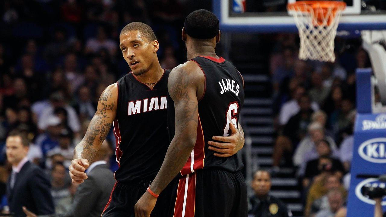 Miami Heat small forward Michael Beasley (8) talks with small forward LeBron James (6) during the second quarter at Amway Center.