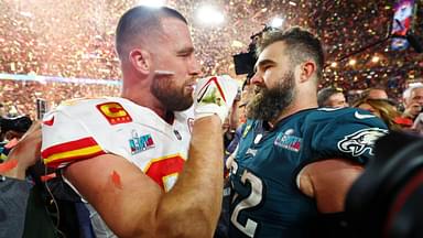 Kansas City Chiefs tight end Travis Kelce (87) talks with his brother Philadelphia Eagles center Jason Kelce (62) after he won Super Bowl LVII at State Farm Stadium.
