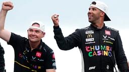 NASCAR Cup Series driver Bubba Wallace (23) celebrates with crew chief Charles Denike on the yard of bricks Sunday, July 27, 2025, during the Brickyard 400 at Indianapolis Motor Speedway.