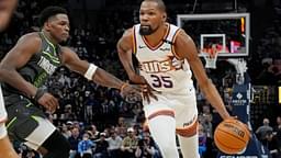 Phoenix Suns forward Kevin Durant (35) brings the ball up as Minnesota Timberwolves guard Anthony Edwards (5) defends him in the fourth quarter at Target Center.