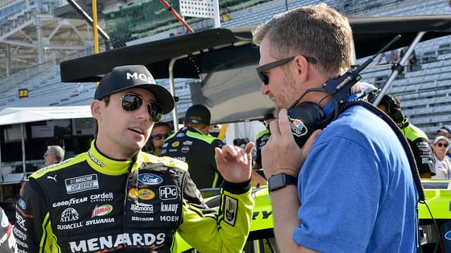 NASCAR Cup Series driver Ryan Blaney (12) talks with Dale Earnhardt Jr. on Saturday, July 30, 2022, during practice for the Verizon 200 at the Brickyard at Indianapolis Motor Speedway.
