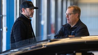 NASCAR Cup Series driver Jimmie Johnson (left) talks with crew chief Todd Gordon in the garage during testing at Phoenix Raceway.