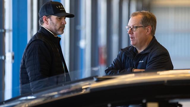 NASCAR Cup Series driver Jimmie Johnson (left) talks with crew chief Todd Gordon in the garage during testing at Phoenix Raceway.