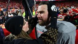 Recording artist Taylor Swift and Kansas City Chiefs tight end Travis Kelce (87) react after the AFC Championship game against the Buffalo Bills at GEHA Field at Arrowhead Stadium.