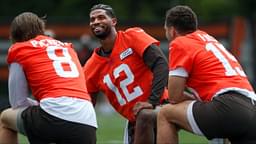 Browns quarterbacks Shedeur Sanders (12), Kenny Pickett (8) and Joe Flacco (15) talk during minicamp June 10, 2025, in Berea, Ohio.