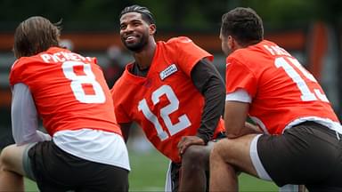 Browns quarterbacks Shedeur Sanders (12), Kenny Pickett (8) and Joe Flacco (15) talk during minicamp June 10, 2025, in Berea, Ohio.