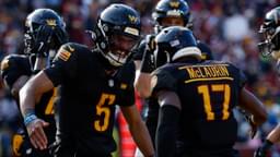 Washington Commanders wide receiver Terry McLaurin (17) and Commanders quarterback Jayden Daniels (5) celebrate after connecting on a touchdown pass against the Tennessee Titans during the first quarter at Northwest Stadium.