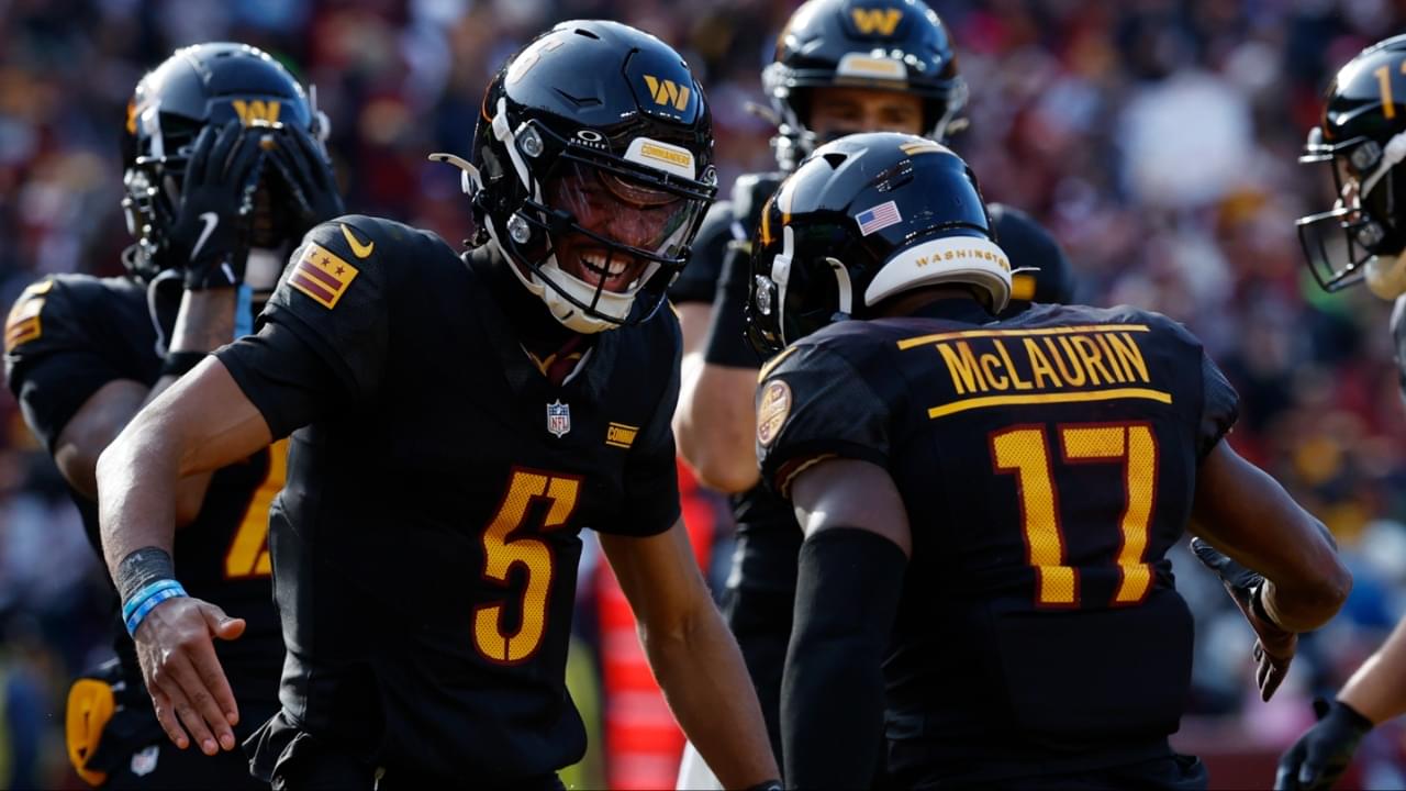 Washington Commanders wide receiver Terry McLaurin (17) and Commanders quarterback Jayden Daniels (5) celebrate after connecting on a touchdown pass against the Tennessee Titans during the first quarter at Northwest Stadium.