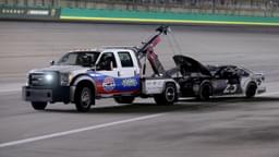 Monster Energy NASCAR Cup Series driver J.J. Yeley (23) is towed off the track during the NASCAR Monster Energy Cup Series Quaker State 400 race, Saturday, July 14, 2018, at the Kentucky Speedway in Sparta, Ky.