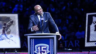 Former NBA star Vince Carter speaks during his jersey retirement ceremony at halftime of a game between the Brooklyn Nets and the Miami Heat at Barclays Center.