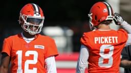 Cleveland Browns quarterback Shedeur Sanders (12) shares a laugh with quarterback Kenny Pickett (8) during NFL training camp practice at the Cleveland Browns training facility, Wednesday, July 23, 2025, in Berea, Ohio.