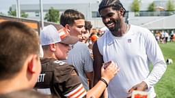 Cleveland Browns quarterback Shedeur Sanders (12) talks to a fan during training camp at CrossCountry Mortgage Campus.