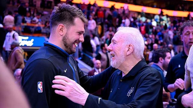 Feb 23, 2023; Dallas, Texas, USA; Dallas Mavericks guard Luka Doncic (left) talks with San Antonio Spurs head coach Gregg Popovich (right) after the game at the American Airlines Center. Mandatory Credit: Jerome Miron-Imagn Images