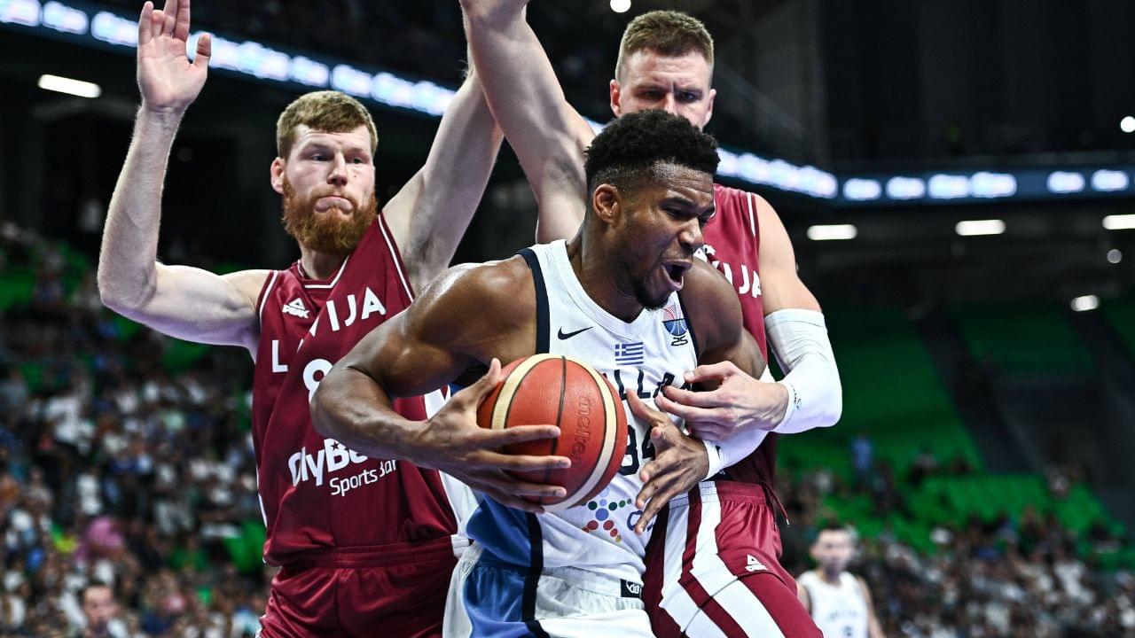 Giannis Antetokounmpo of Greece competes with Davis Bertans and Kristaps Porzingis of Latvia