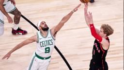 Gradey Dick (1) of Toronto Raptors in action against Derrick White (9) of Boston Celtics during the NBA