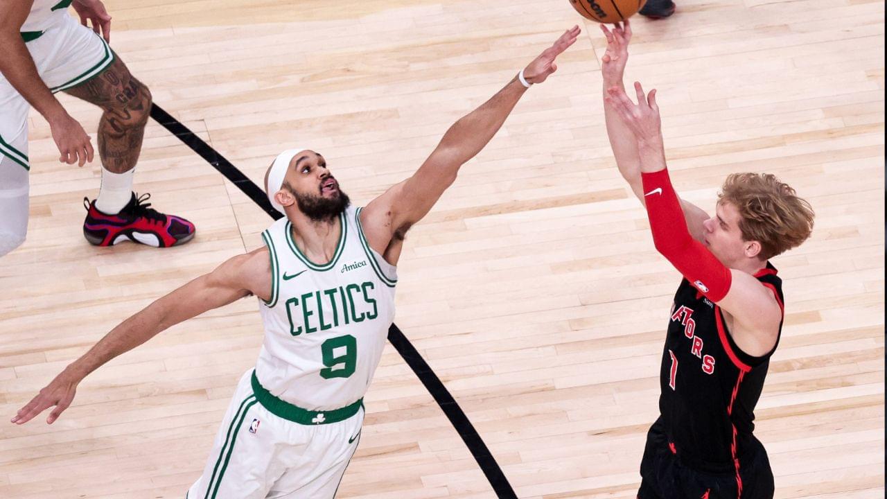 Gradey Dick (1) of Toronto Raptors in action against Derrick White (9) of Boston Celtics during the NBA