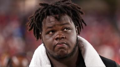 Tampa Bay Buccaneers defensive tackle Desmond Watson (56) looks on from the bench during a preseason game against the Buffalo Bills at Raymond James Stadium.