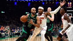 Boston Celtics guard Derrick White (9) controls the ball while New York Knicks guard Miles McBride (2) defends in the second half during game five of the second round for the 2025 NBA Playoffs at TD Garden.